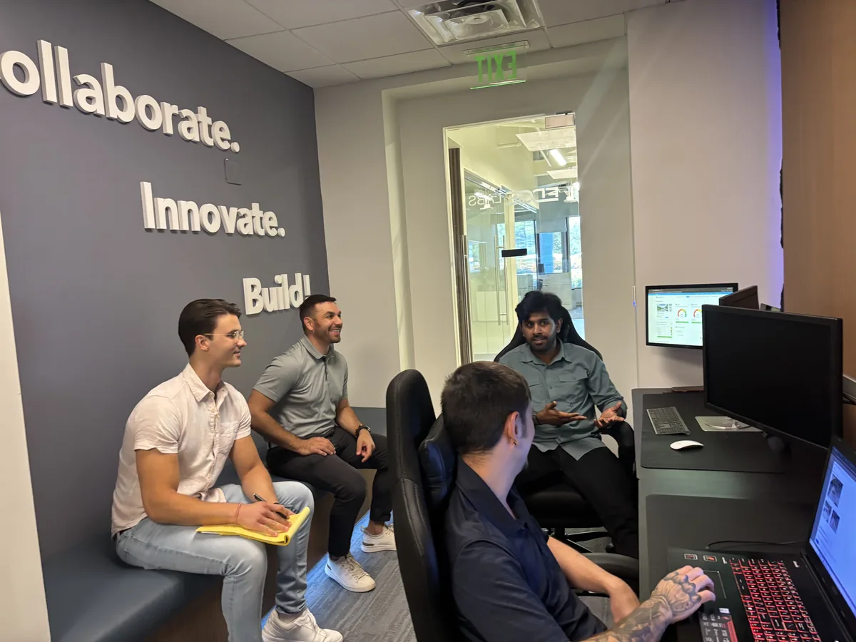 Programmers working on software inside the Rent Solutions office